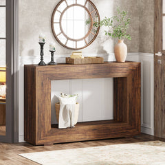 Wooden console table with decorative items in a room setting