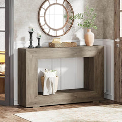 Wooden console table with decorative items in a room setting
