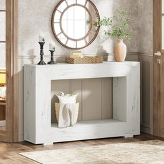 White console table with decorative items in a room setting
