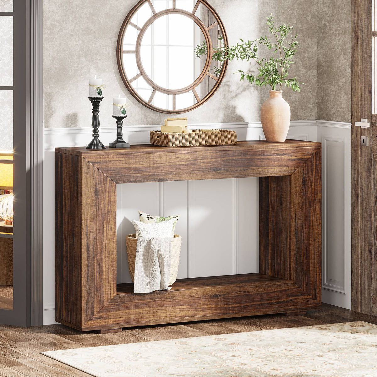 Wooden console table with decorative items in a room setting