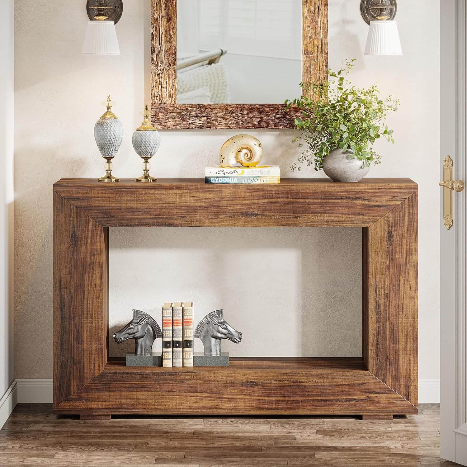 Wooden console table with decorative items in a room setting
