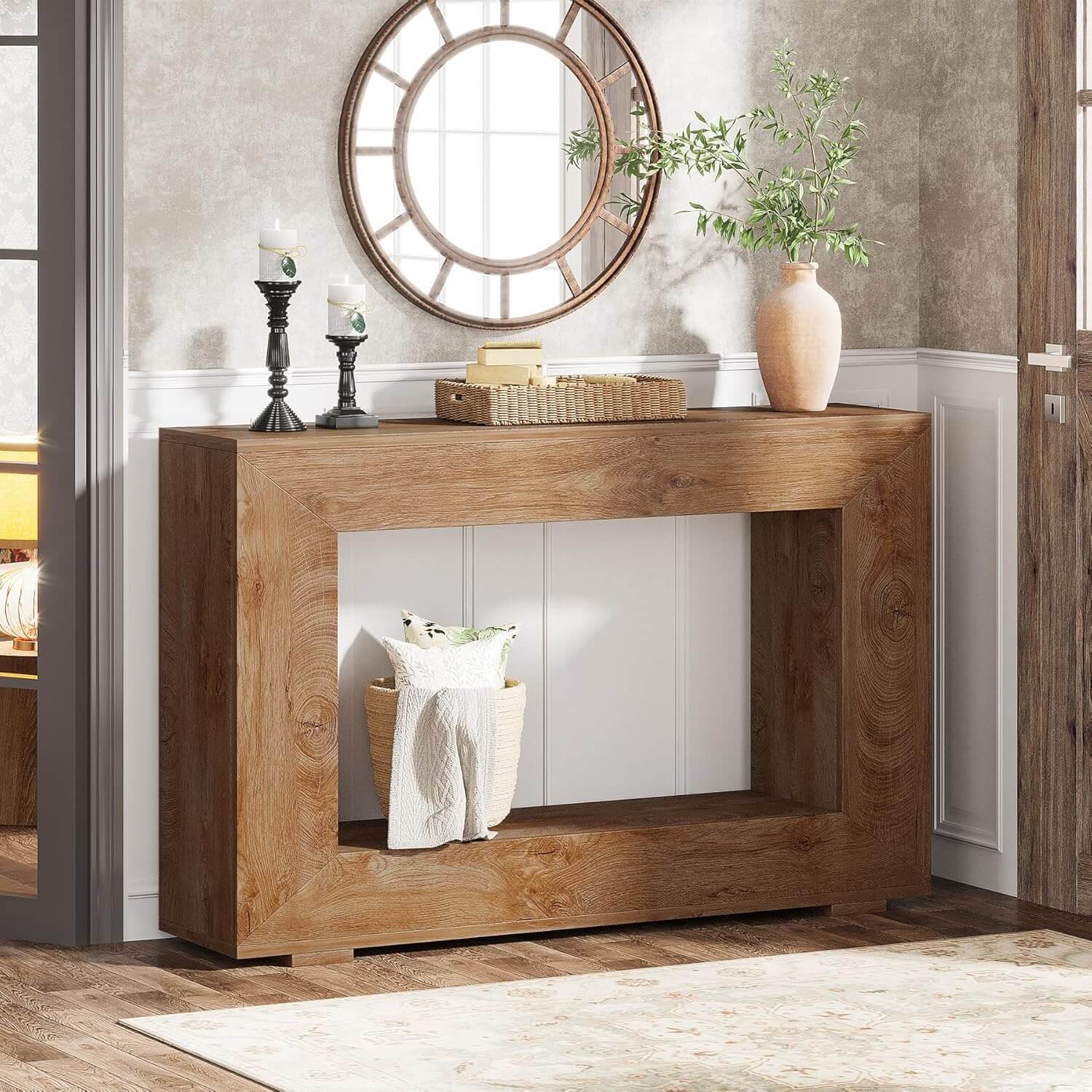 Wooden console table with decorative items in a room setting