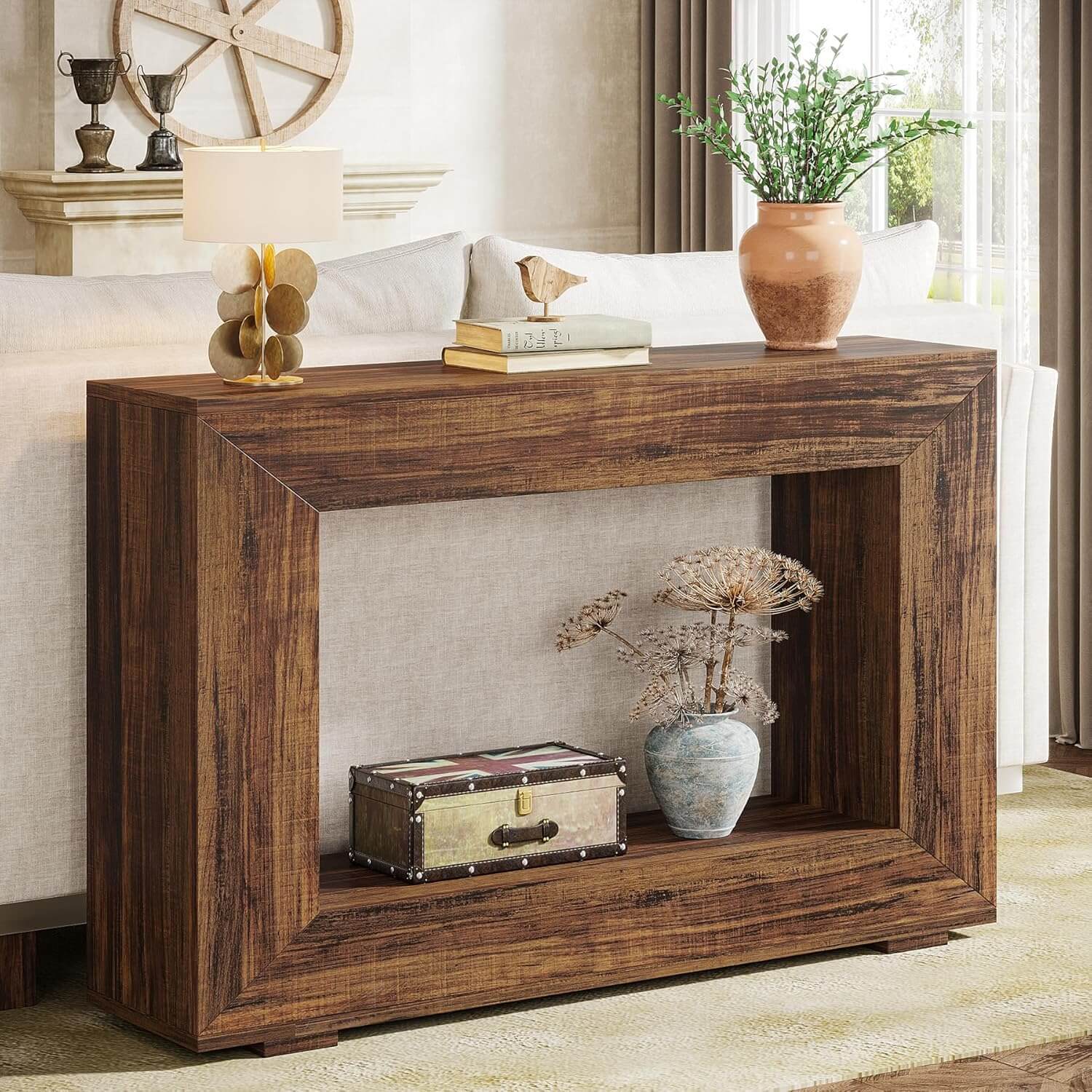 Wooden console table with decorative items in a living room setting