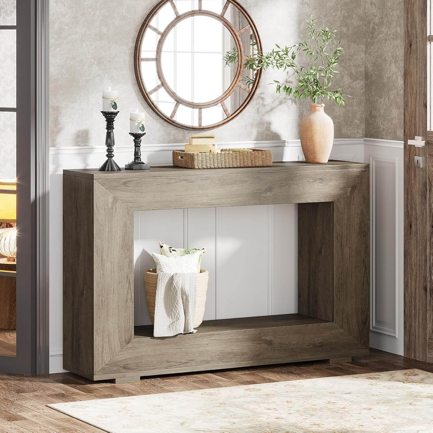 Wooden console table with decorative items in a room setting